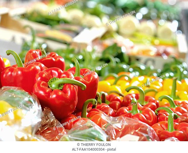 Fresh bell peppers on display at supermarket
