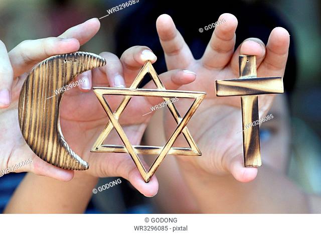 Christianity, Islam, Judaism, the three monotheistic religions with symbols of Jewish Star, Muslim Crescent and Christian Cross, Vietnam, Indochina