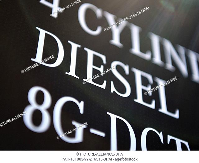 03 October 2018, France, Paris: ""4-Cylinder Diesel 8G-DCT"" is on an information board at the Mercedes-Benz stand on the 2nd press day of the Paris...