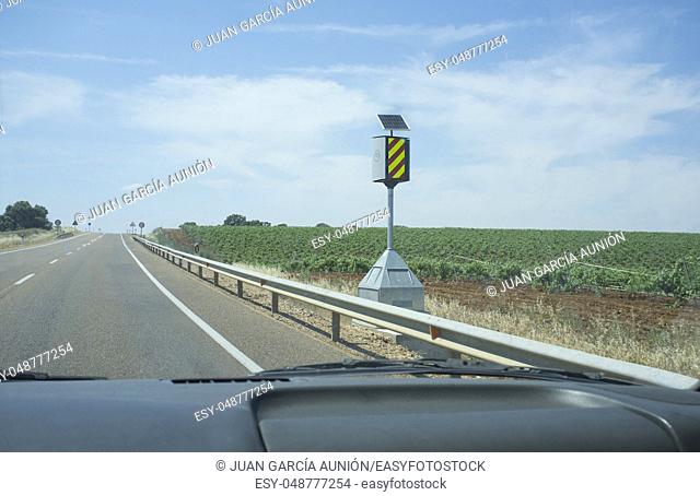 Spanish speed control pole device at country road. View from the inside of the car