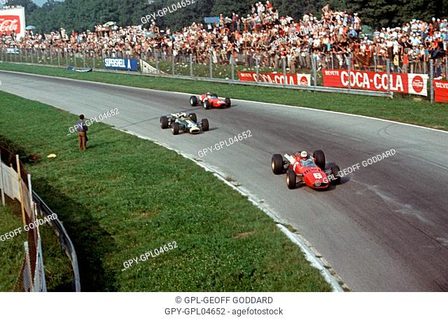 17 John Surtees and 6 Scarfiotti in  Ferraris and Jim Clark in a Lotus at the parabolica corner, Italian GP 1966