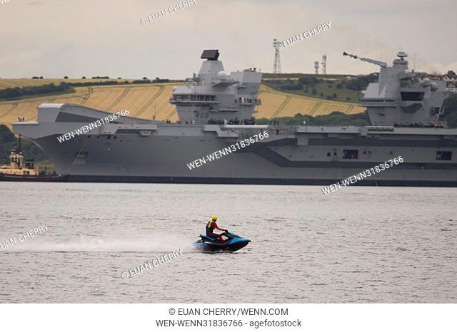 The HMS Queen Elizabeth turns in Rosyth Docks as it is due to set sail down the Fourth under the Rail bridge with just 6 feet to spare