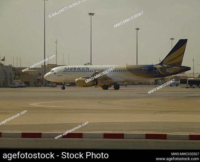 A plane parked at the Muscat International Airport