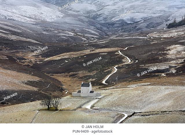 Corgarff castle and Cairngorms in winter