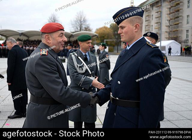 12 November 2023, Berlin: Carsten Breuer, Inspector General of the Bundeswehr, congratulates recruits at the ceremonial swearing-in on the 68th anniversary of...