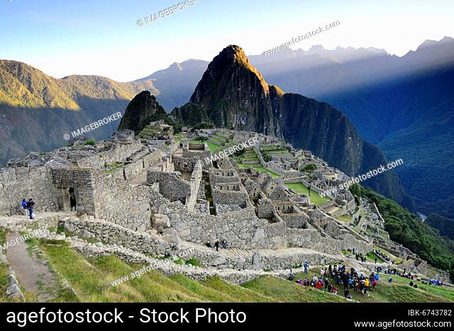 Inca ruined city with Mount Huayna Picchu with first rays of sun, Machu Picchu, Urubamba Province, Peru, South America