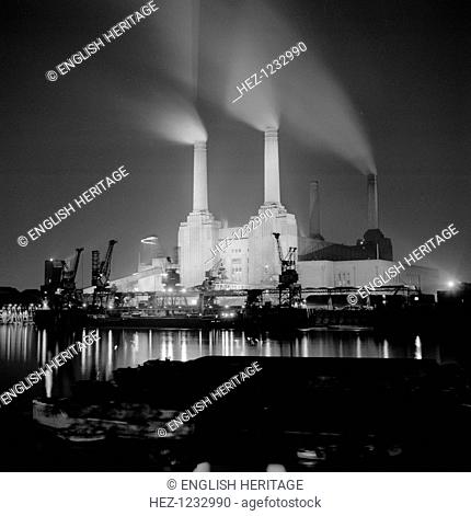 Battersea Power Station, London, 1945-1980. View from the north bank of the Thames. It was designed in 1937 by Sir Giles Gilbert Scott (1880-1960) and was the...