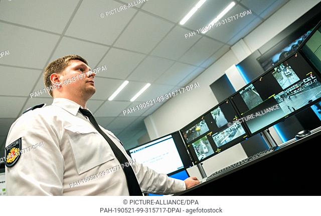 21 May 2019, Bremen: Police Commissioner Marco Walker stands in front of a table in a room of the Bremen Police Headquarters and looks at monitors on which the...