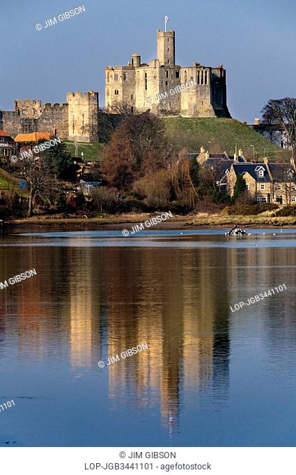 England, Northumberland, Warkworth. The ruins of Warkworth Castle sited above the River Coquet
