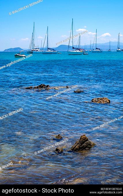 Golfo Aranci, Sardinia / Italy - 2019/07/16: Panoramic view of Golfo Aranci harbor by the yacht port - Marina di Golfo Aranci - at the Tyrrhenian Sea coast