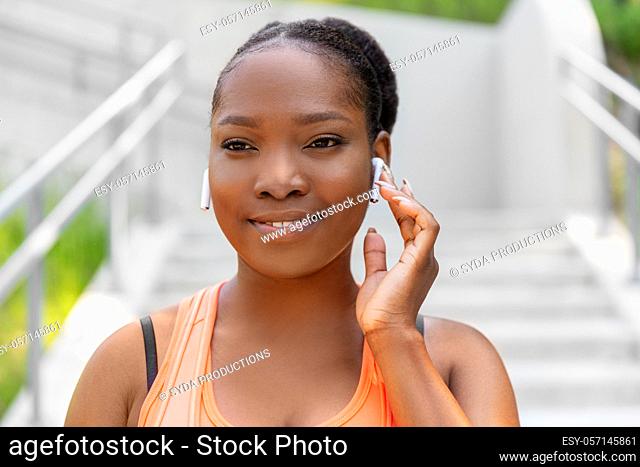 happy african american woman with earphones