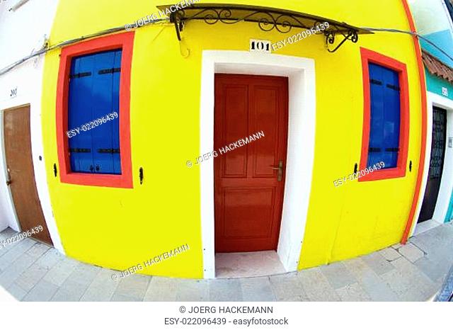 Colourful facade of an old house at Burano island near Venice, Italy