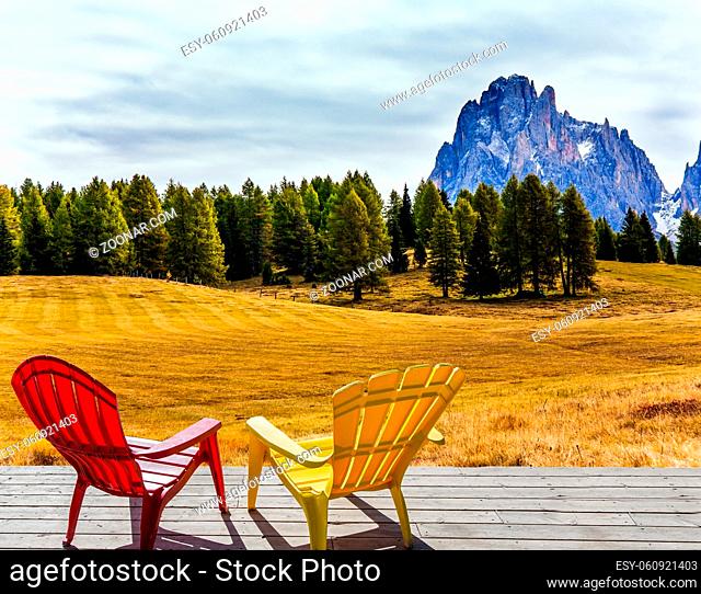 Wonderful holiday in the fresh air. Two comfortable lounge chairs on the hotel terrace. Alpe di Siusi is charming plateau in the Dolomites
