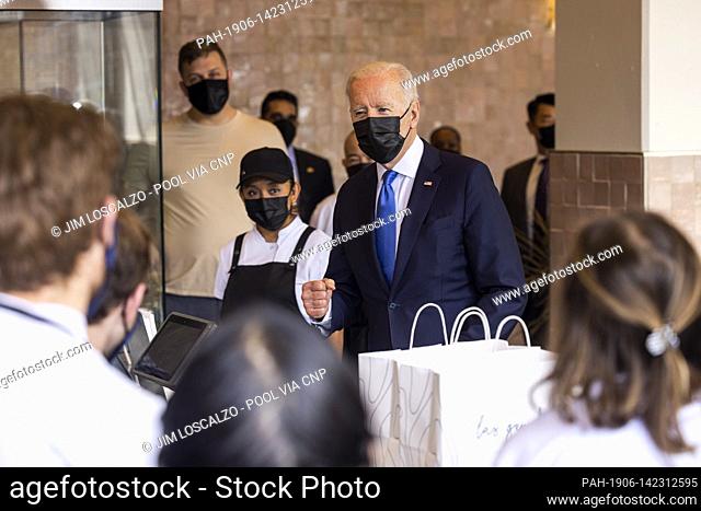 United States President Joe Biden speaks to workers as he picks up tacos during a visit to Las Gemelas Restaurant in Washington, DC, USA, 05 May 2021