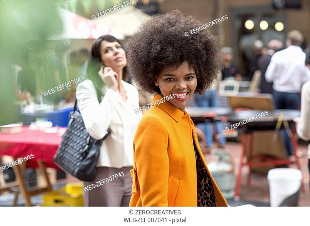 Portrait of smiling woman in the city