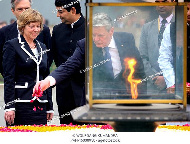 President of Germany Joachim Gauck and his partner Daniela Schadt participate in a wreath lying at the cremation site of Mahatma Gandhi in New Delhi, India