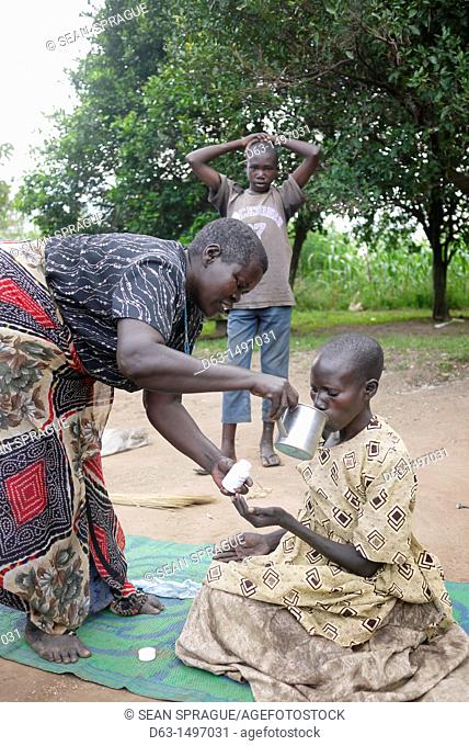 UGANDA    The work of Comboni Samaritans, Gulu  Visiting Atoo Alice, 48, who has AIDS and suffers from depression  She lives with her 52-year-old sister...