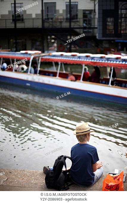 Boy looking the river in Candem Town, London, England, UK