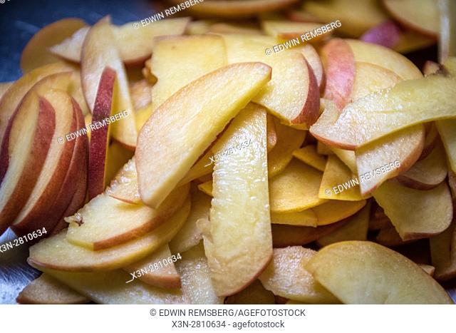 Fresh sliced apples are prepped for cooking at Gertrude's restaurant in Baltimore, Maryland