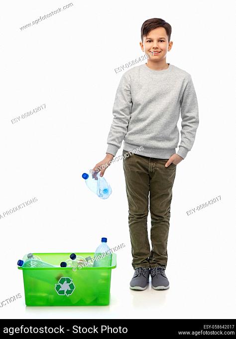 smiling boy sorting plastic waste
