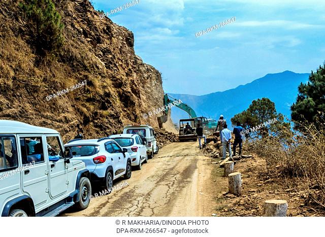 Clearing landslide with Tata Hitachi excavator, Rishikesh, Uttarakhand, India, Asia