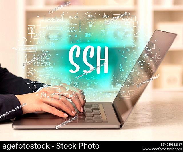 hand working on new modern computer with SSH abbreviation, modern technology concept