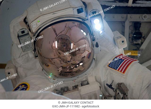 Attired in his Extravehicular Mobility Unit (EMU) spacesuit, NASA astronaut Alvin Drew, STS-133 mission specialist, is pictured in the International Space...