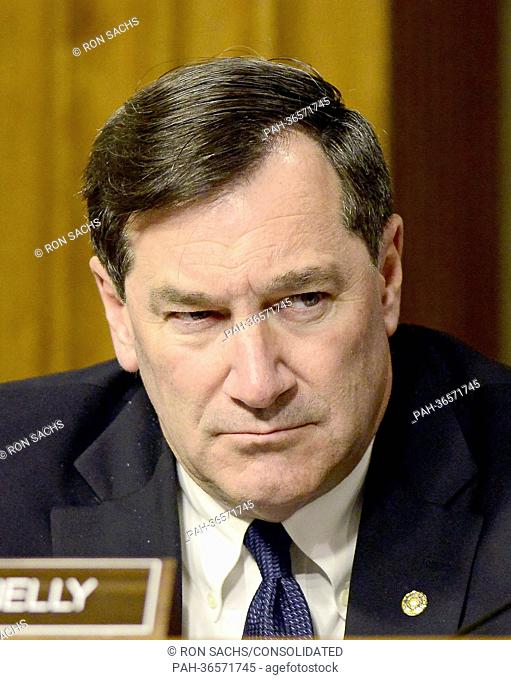 United States Senator Joe Donnelly (Democrat of Indiana) listens as former U.S. Senator Chuck Hagel (Republican of Nebraska) appears at a U.S