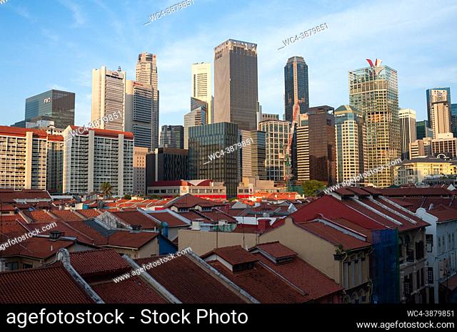 Singapore, Republic of Singapore, Asia - Cityscape over the roofs of the historic shophouses in Chinatown with modern skyscrapers in the central business...