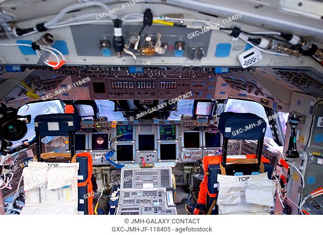 The flight stations for NASA astronauts Chris Ferguson, STS-135 commander, and Doug Hurley, pilot, (both temporarily working on tasks out of frame) were...