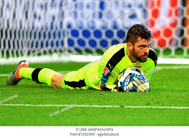 Goalkeeper Matus Kozacik of Slovakia lies on the pitch during the preliminary round Group B match between Slovakia and England at Geoffroy Guichard stadium in...