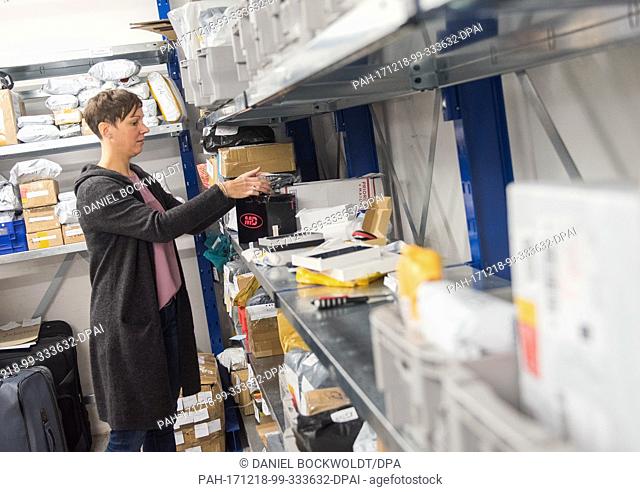 Sarah Garbers, Director of Clearance of Hamburg's Main Customs Office, checking postal parcels in Hamburg, Germany, 18 December 2017