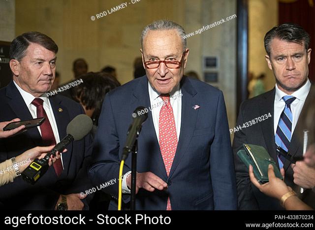 United States Senate Majority Leader Chuck Schumer (Democrat of New York), center, is joined by United States Senator Mike Rounds (Republican of South Dakota)