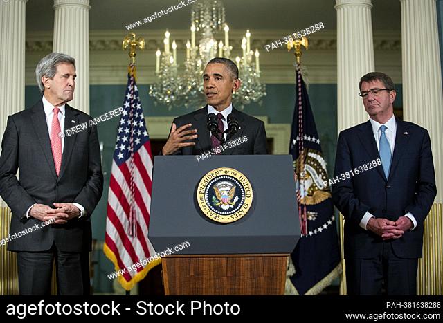 Flanked by United States Secretary of State John Kerry, left, and US Secretary of Defense Ashton Carter, right, US President Barack Obama, center