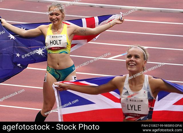27 August 2021, Japan, Tokio: Paralympics: Athletics, 100m, women, final, at Olympic Stadium. Silver medallist Isis Holt from Australia and bronze medallist...