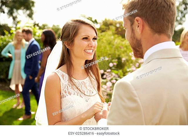 Romantic Young Couple Getting Married Outdoors