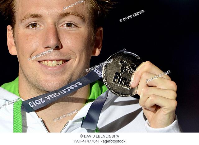 Marco Koch of Germany poses with his silver medal after the men's 200m Breaststroke final of the 15th FINA Swimming World Championships at Palau Sant Jordi...