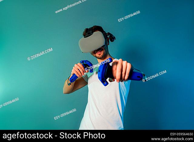 Man using a gaming gadget for virtual reality. Augmented reality in gaming