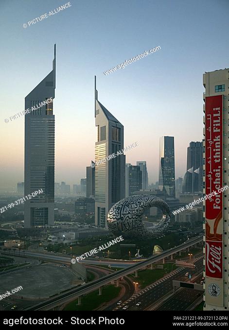02 December 2023, United Arab Emirates, Dubai: The Museum of The Future on Sheikh Zayed Road next to the Jumeirah Emirates Tower in the city center