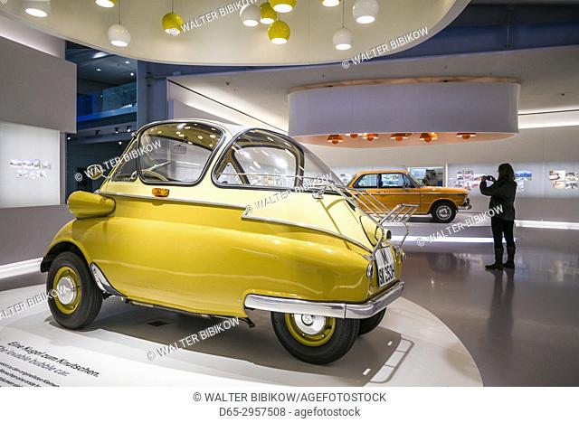 Germany, Bavaria, Munich, BMW Museum, 1955 BMW Isetta bubble car with photographer, MR-GER-17-001