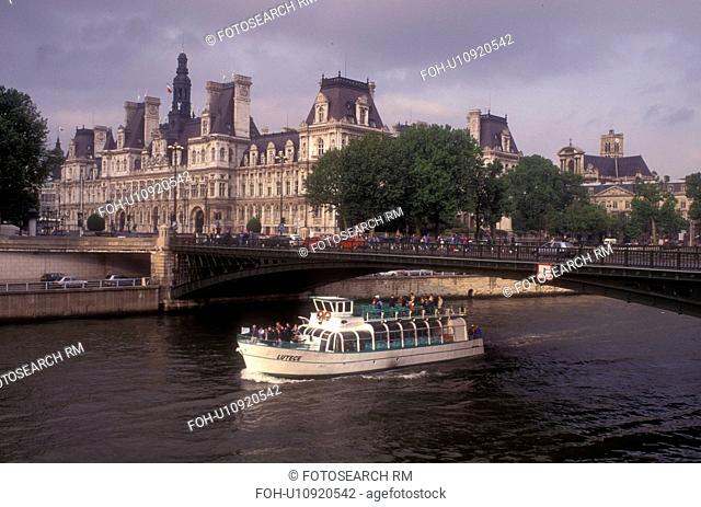 Paris, France, boat, Europe, Seine River, A scenic view of the Rive Droite (Right Bank) and Hotel de Ville (City Hall) as a bateau mouche (tourboat) makes it...