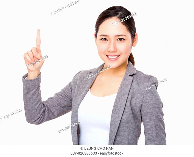 Young businesswoman with finger point up