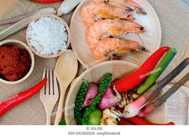 spices in bowl and prawn on sackcloth background