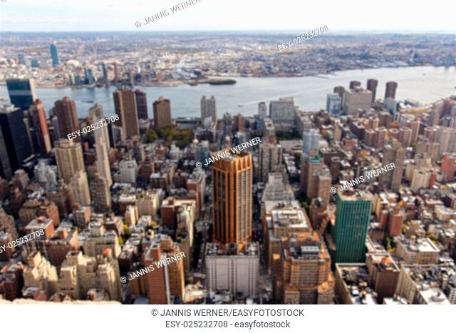 Blurred background of the Manhattan cityscape facing East towards Brooklyn from the Empire State Building in New York, NY