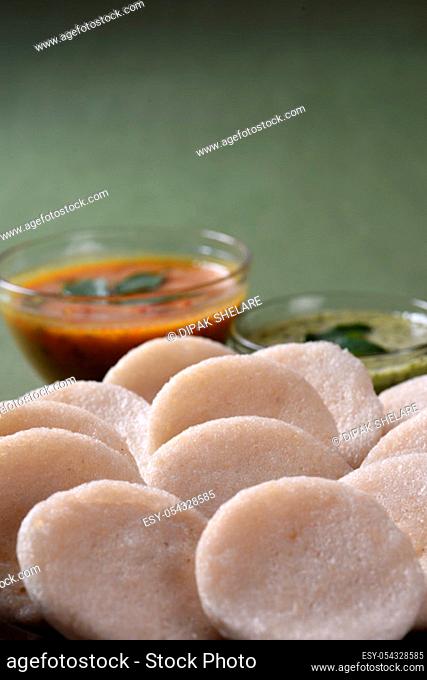 Idli with Sambar and coconut chutney, Indian Dish : south Indian favourite food rava idli or semolina idly or rava idly, served with sambar and green chutney