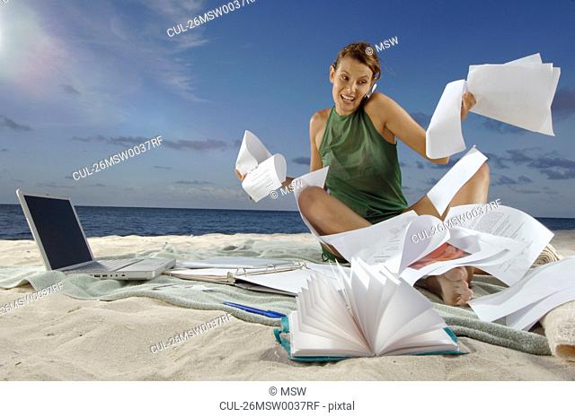 Woman working on beach