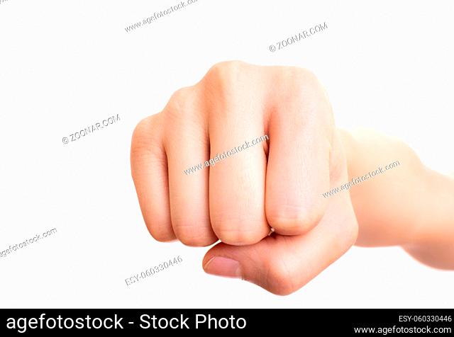 Close up of a female fist punching the camera, isolated on white background. Front view