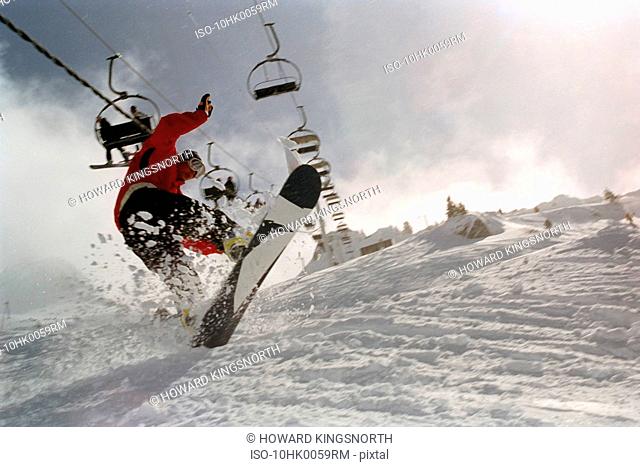 Male in action on a snowboard