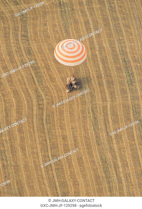 The Soyuz TMA-22 spacecraft is seen as it lands with Expedition 30 Commander Dan Burbank, and Flight Engineers Anton Shkaplerov and Anatoly Ivanishin in a...