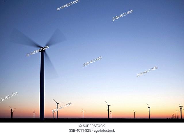 Wind turbines on a hill at dusk, Roscoe, Nolan County, Texas, USA